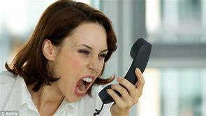 Woman screaming at a phone